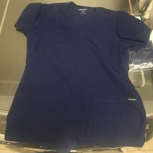 New with tags. XS navy jockey scrubs.
